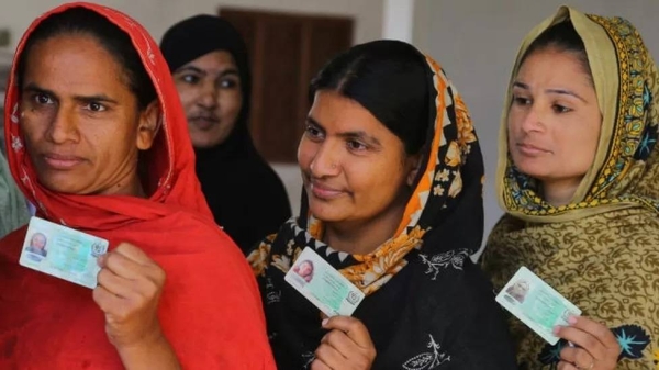 Women stand in line to cast their votes for the Local Government Elections in front of a polling station in the town of Qasimabad, Hyderabad, Pakistan on January 15, 2023.