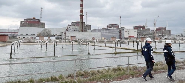 An IAEA expert mission team walks around the Zaporizhzhya Nuclear Power Plant and its surrounding area. (file) — courtesy IAEA/Fredrik Dahl