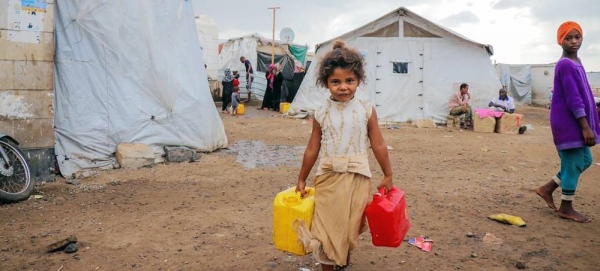 A child fetches clean water at a camp for displaced people in Dar Saad in Yemen. (file). — courtesy UNOCHA/Mahmoud Fadel-YPN