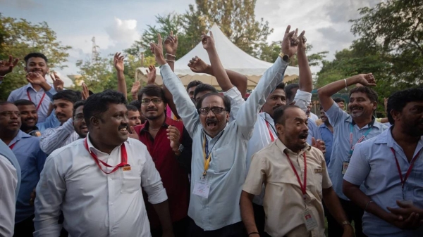 Employees of the Indian Space Research Organisation (ISRO) celebrate after the successful landing of the Chandrayaan-3 mission.