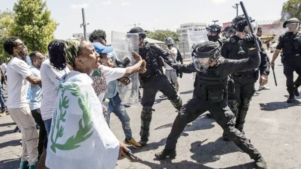 Eritrean asylum seekers clash with the Israeli police in Tel Aviv on Friday. — courtesy Getty Images