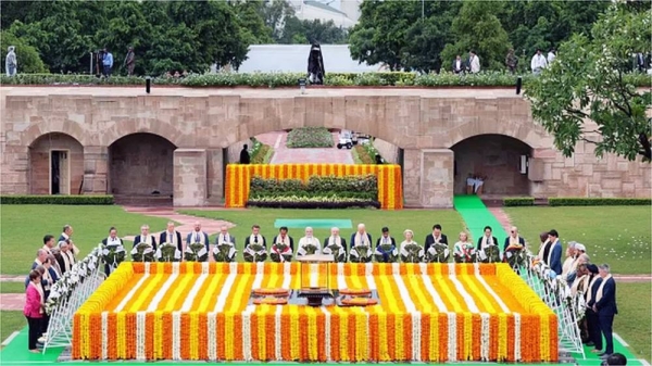 
India’s Prime Minister Narendra Modi (C) along with world leaders pays respect at the Mahatma Gandhi memorial at Raj Ghat on the sidelines of the G20 summit in New Delhi on Sunday. — courtesy Getty Images