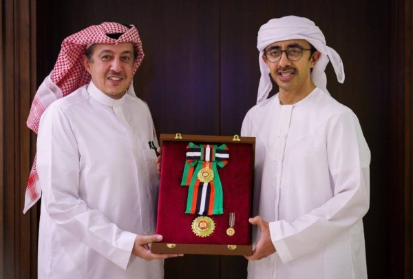 UAE’s Minister of Foreign Affairs Sheikh Abdullah bin Zayed Al-Nahyan presents the Zayed the Second Medal to Saudi Ambassador to UAE Turki Al-Dakhil in Abu Dhabi on Monday.