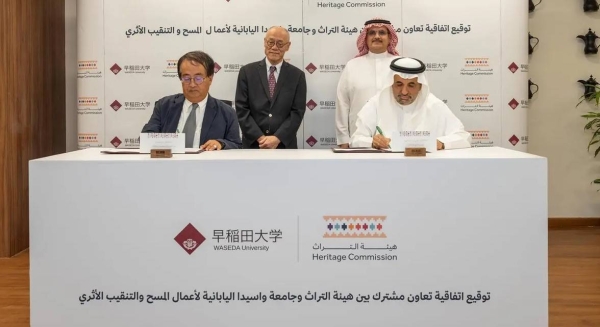 Heritage Commission CEO Dr. Jasser Al-Harbash, and a representative of the WU Comprehensive Research Organization, Dr. Hasegawa So sign the cooperation agreement at the HC headquarters, King Abdulaziz Historical Center.
