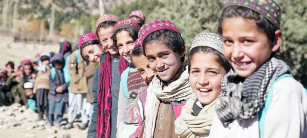 Children line up outside a community education class in Spera District, Afghanistan. Reaching the SDGs will likely cost more than $1,200 per person per year to 2030. — courtesy UNICEF/Mihalis Gripiotis