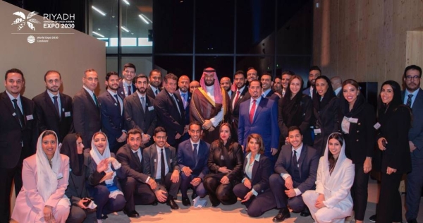 Crown Prince Mohammed bin Salman poses for a picture with the team working behind Riyadh's bid to host Expo 2030.