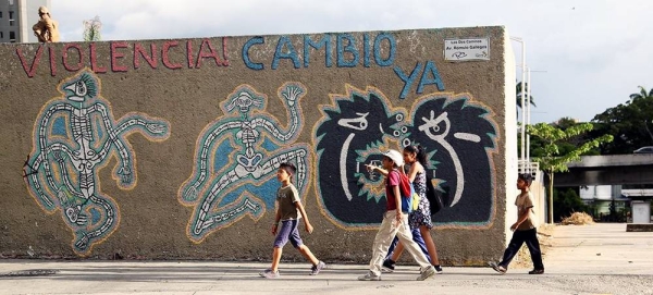 Children walk past street graffiti in Caracas, Venezuela. (file). — courtesy UNICEF/Velasquez