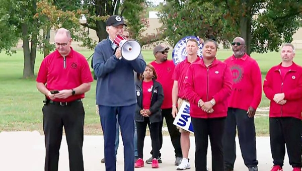 Biden addresses autoworkers on picket line.