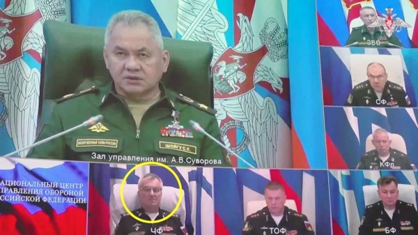 Still from footage shows video link with Defense Minister Sergey Shoigu on big screen and Adm. Sokolov immediately below him. — courtesy Reuters