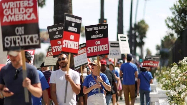 Actors and writers strike outside Netflix's offices.