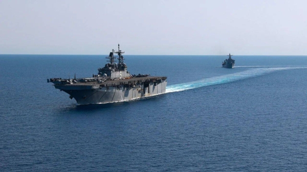 Amphibious assault ship USS Bataan and USS Carter Hall, deployed to help ensure maritime security and stability in the Middle East region, sail together in the Red Sea, in this photo taken on August 8