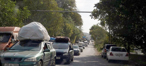 Refugees arrive in the border town of Goris in Armenia. — courtesy WHO/Nazik Armenakyan