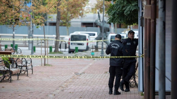 Police officers stand guard in Ankara following the blast on Sunday