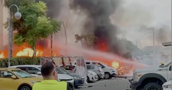 A screengrab shows an area on fire as rockets are launched from the Gaza Strip, in Ashkelon, southern Israel Saturday.