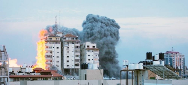 A building is engulfed in flames in central Gaza. — courtesy UN News/Ziad Taleb