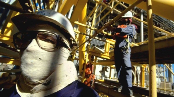 A worker stands in the technical zone at Saudi national oil company Aramco in Saudi Arabia