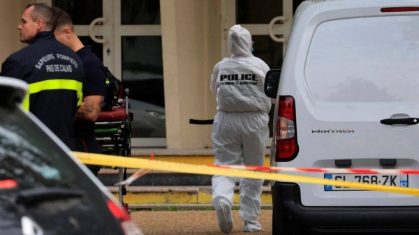 French police and fire fighters secure the area following a knife attack at the Lycee Gambetta-Carnot High School in Arras, northern France on Friday