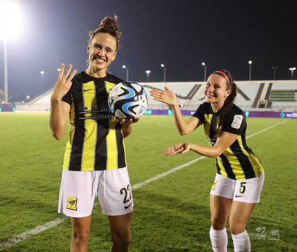 Ashleigh Plumptre celebrates her first hat-trick with a special pose from Leighanne Robe.