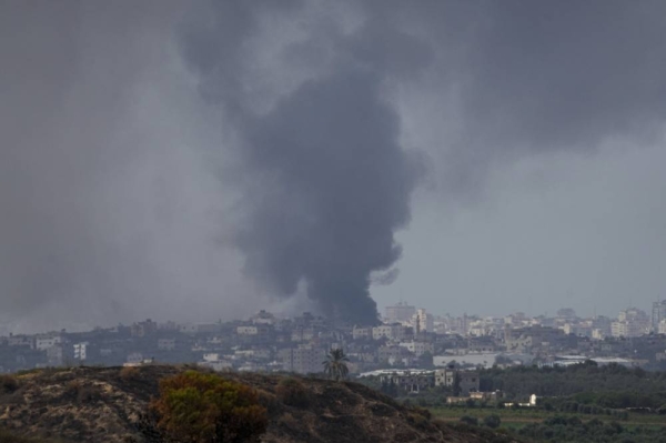 Smoke rises following an Israeli airstrike in the Gaza Strip, as seen from southern Israel, Tuesday, Oct. 17, 2023. Israel has been striking targets throughout Gaza since a bloody, cross-border attack by Hamas militants killed over 1,400 and captured many Israelis on Oct. 7. (AP Photo/Ariel Schalit)