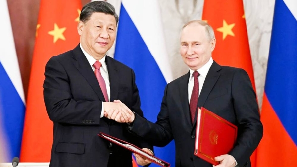 Chinese leader Xi Jinping and Russian President Vladimir Putin shake hands after signing a joint statement during Xi's state visit to Moscow in March 2023. — courtesy Xinhua/Getty Images