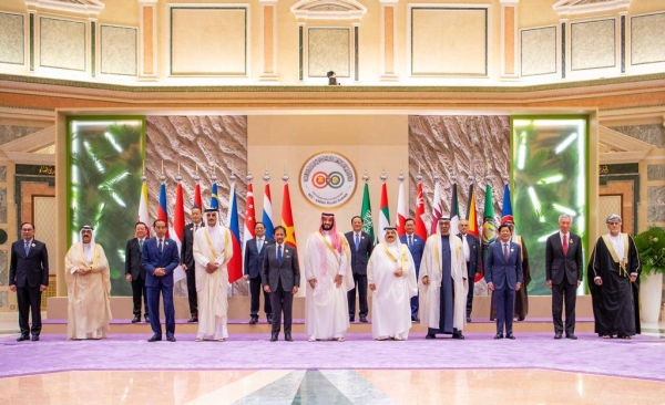 The GCC and ASEAN leaders pose for a group photo at the start of their joint summit.