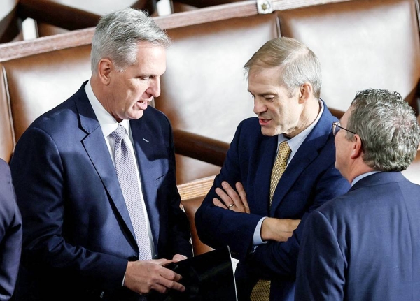 Former Speaker of the House Kevin McCarthy talks with Rep. Jim Jordan on Friday prior to the third round of voting for House Speaker. — courtesy Reuters