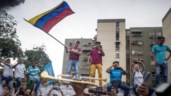 Supporters of Venezuelan presidential pre-candidate Maria Corina Machado take part in a political rally on an avenue in Maracay, Venezuela. — courtesy EPA