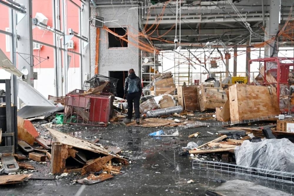 Officials examined the damaged postal terminal following the attack. — courtesy AFP/Getty Images