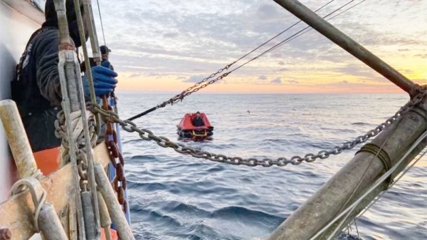 A good Samaritan vessel is seen approaching the life raft on the morning of Thursday. — courtesy USCGPacificNorthwest/X
