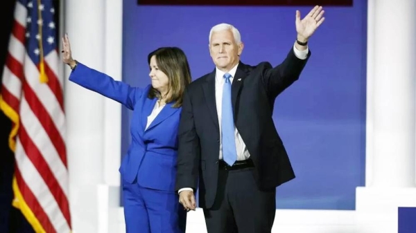 Mike Pence and his wife Karen Pence wave after announcing his withdrawal from the race. — courtesy EPA-EFE/REX/Shutterstock