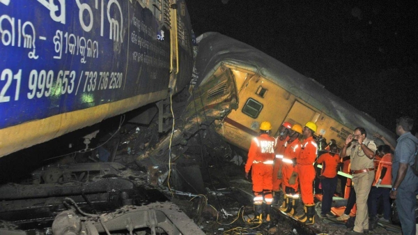 Rescuers at the scene of the train collision in Vizianagaram district, Andhra Pradesh state, India, October 29