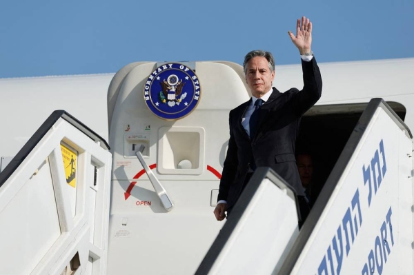 US Secretary of State Antony Blinken waves as he disembarks from an aircraft for the start of his visit to Israel, amid the ongoing conflict between Israel and the Palestinian Islamist group Hamas, at Ben Gurion International airport near Tel Aviv on November 3, 2023. Blinken arrived in Israel on November 3, an AFP correspondent travelling with him said, in a trip focused on measures to minimise harm to civilians in the war in Gaza. (Photo by JONATHAN ERNST / POOL / AFP) (Photo by JONATHAN ERNST/POOL/AFP via Getty Images)