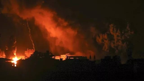 Fire and smoke rises from buildings following Israeli airstrikes on Gaza City, Sunday, Nov. 5, 2023