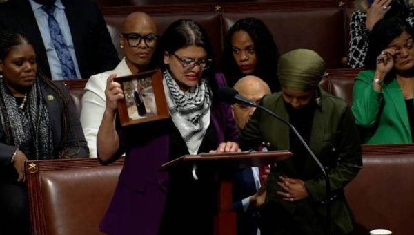 Rep. Rashida Tlaib defends herself against censure tears up on House floor.