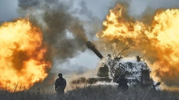 A self-propelled artillery vehicle fires on the frontline, Donetsk region, Ukraine, Saturday, Feb. 18, 2023