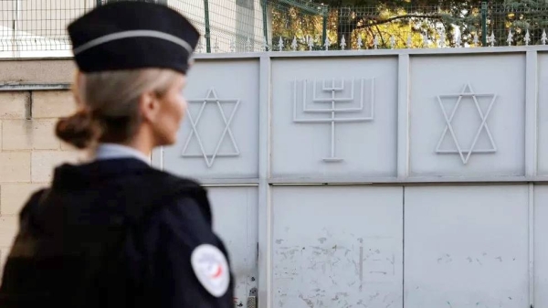 A French police officer stands guard in front of the Synagogue of Sarcelles, Paris’s suburb. — courtesy Getty Images