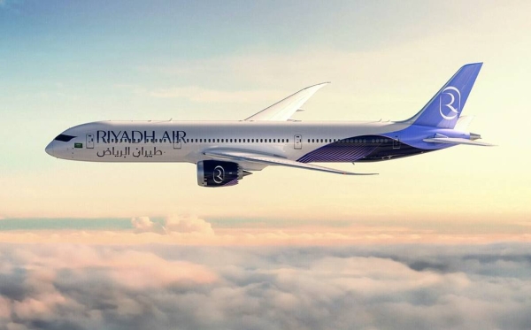The second livery showcases Riyadh Air aircraft adorned in a lavender and indigo paint scheme, with a feather-like design near the rear of the fuselage. 