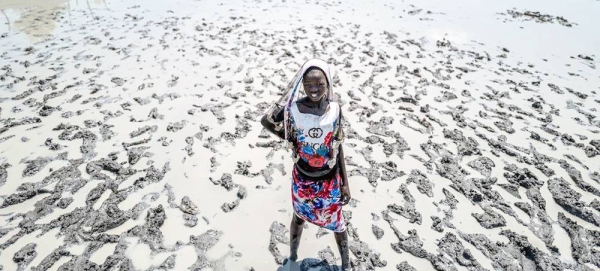 A young girl walks in the flooded village of Ulang in South Sudan. — courtesy UNICEF/UN0548109/Jan Grarup