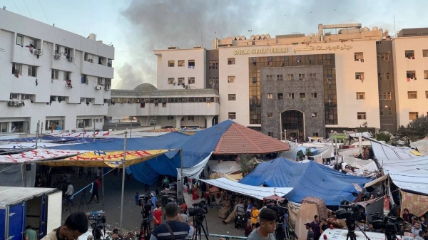 Smoke rises as displaced Palestinians take shelter at Al-Shifa hospital, amid the ongoing conflict between Hamas and Israel, in Gaza City, November 8, 2023