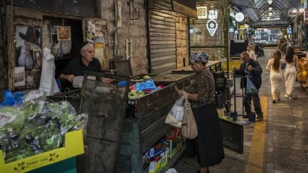 A woman shops at the Mahane Yehuda market in Jerusalem, Monday, November 13, 2023