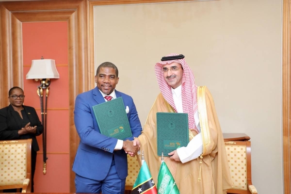 SFD CEO Sultan Al-Marshad (right), poses for a photo with Prime Minister of the Saint Kitts and Nevis Terence Drew, following the signing of the MoU.