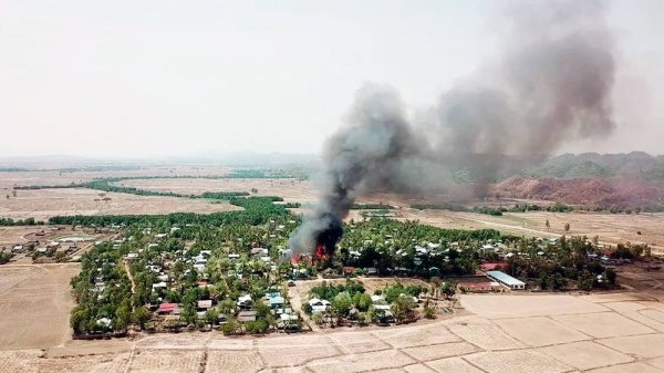 In this photo released by the Myanmar Army, a fire burns May 16, 2020, in the predominantly ethnic Rakhine village of Let Kar in Rakhine State's Mrauk-U township, western Myanmar. – courtesy Myanmar Army via AP