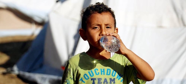 A five-year-old boy drinks bottled water delivered by UNICEF in the Khan Younis camp. — courtesy UNICEF/Eyad El Baba