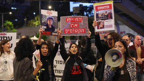 Families and friends of hostages held in Gaza call for Israeli Prime Minister Benjamin Netanyahu to bring them home, during a demonstration in Tel Aviv on November 21, 2023