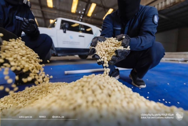 The Zakat, Tax and Customs Authority officials inspect the seized drug pills at the Jeddah Islamic Port.