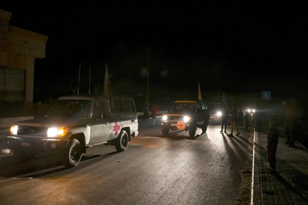 International Red Cross vehicles reportedly carrying Israeli hostages released by Hamas cross the Rafah border point in the Gaza Strip on the way to Egypt from which they would be flown to Israel to be reunited with their families, on November 24, 2023. After 48 days of gunfire and bombardment that claimed thousands of lives, a four-day truce in the Israel-Hamas war began on November 24 with 50 hostages set to be released in exchange for 150 Palestinian prisoners. (Photo by Mohammed ABED / AFP) (Photo by MOHAMMED ABED/AFP via Getty Images)