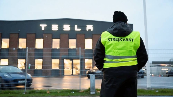 Emma Hansson, chairman of IF Metall Stockholms lan, stands on strike outside Tesla’s Service Center in Segeltorp, as workshop workers at the electric car company Tesla have gone on strike demanding that the company sign a collective agreement, in Stockholm, Sweden. — courtesy TT News/via Reuters