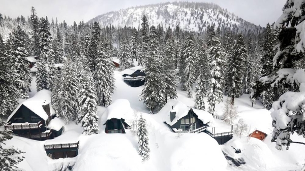 Snow is piled up from new and past storms in the Sierra Nevada mountains, in the wake of an atmospheric river event, on March 12, 2023 in Mammoth Lakes, California. — courtesy Getty Images