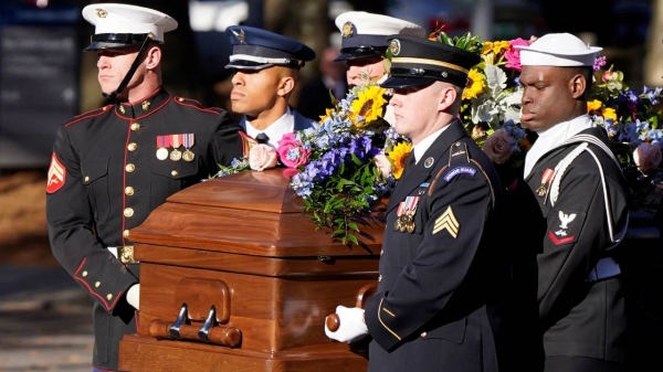 A military team carries the casket of former first lady Rosalynn Carter upon arrival at the Jimmy Carter Presidential Library and Museum, Monday, Nov. 27, in Atlanta