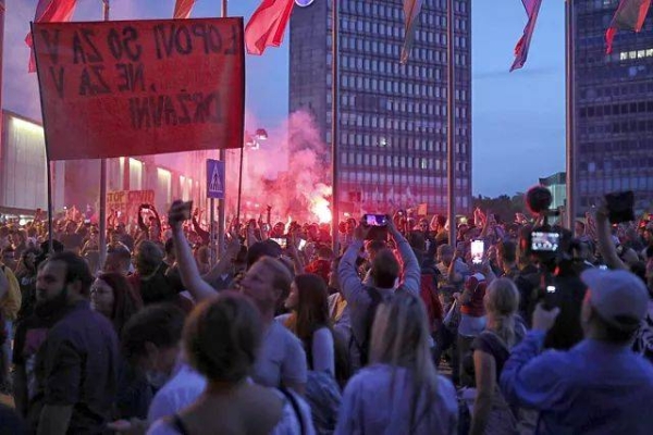 Anti-vaccination protesters gather near parliament in Ljubljana, Slovenia, Wednesday, Sept. 15, 2021